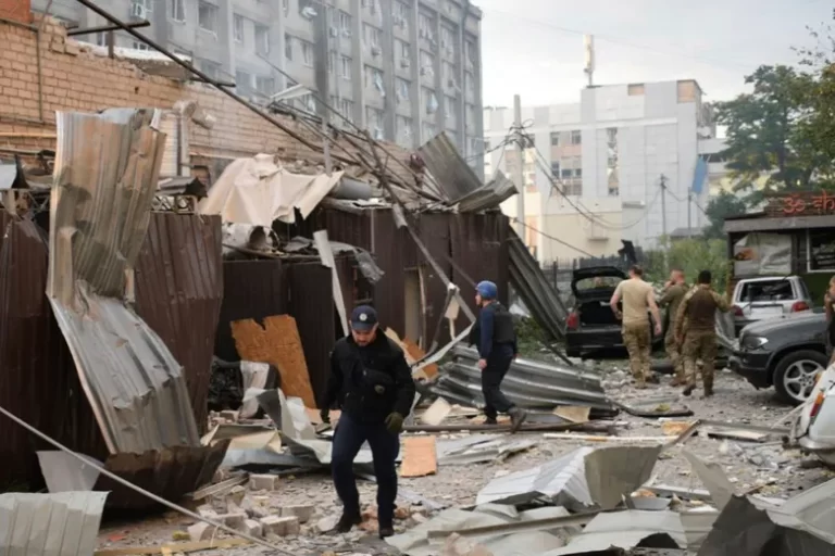 Ukraine accuses a local man of directing a missile strike that killed 11 at a pizza restaurant