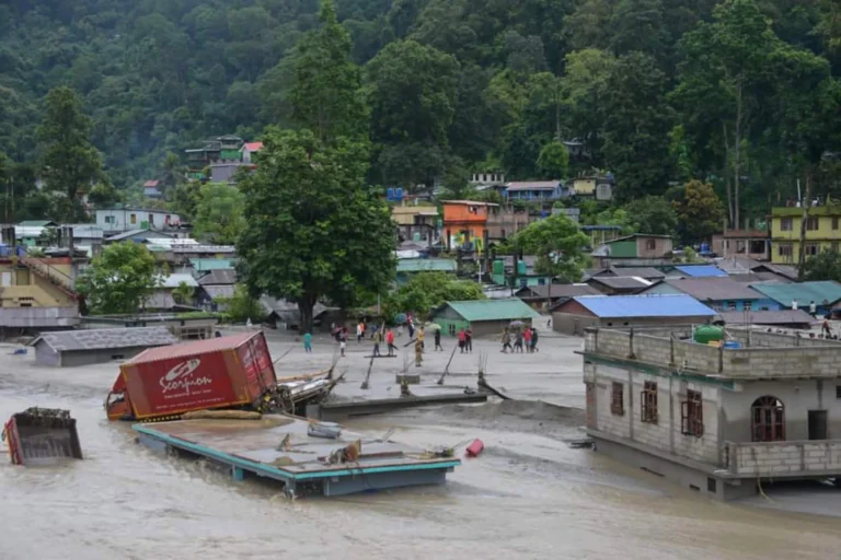 Flash floods kill at least 18 in northeastern India and leave nearly 100 missing