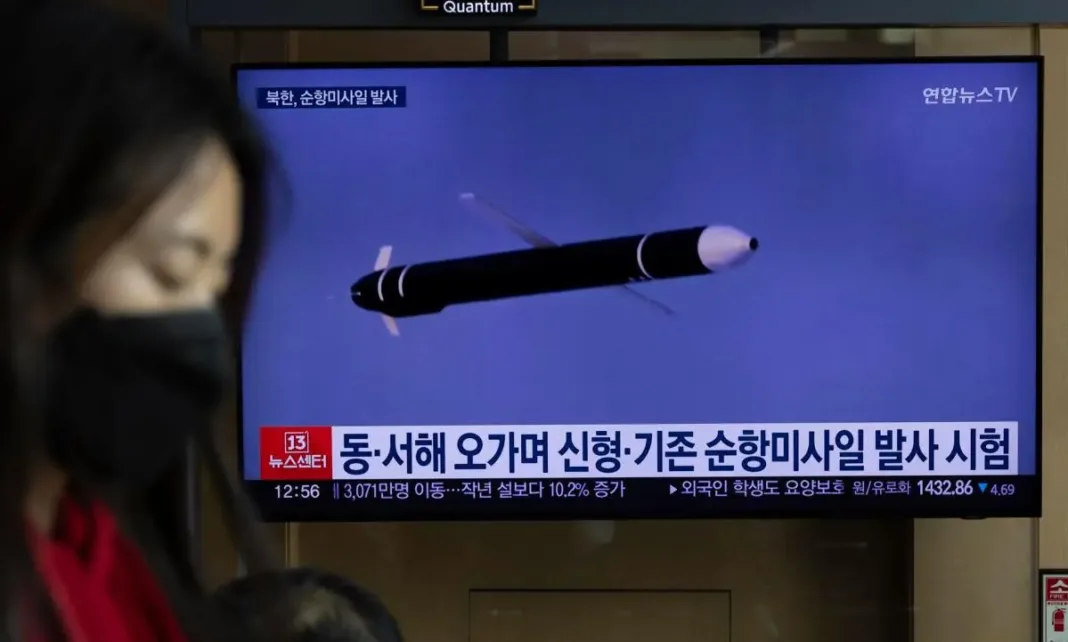 A woman watches missiles