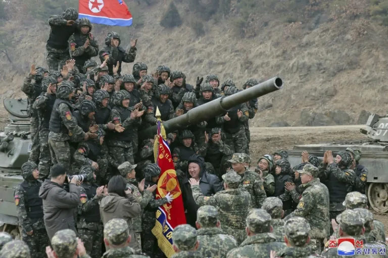 North Korea’s Kim test drives a new tank and orders troops to prepare for war