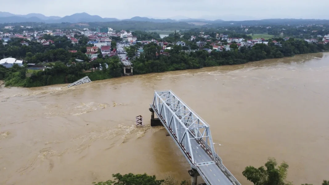 Vietnam storm deaths rise to 64 as a bridge collapses and flooding sweeps away a bus