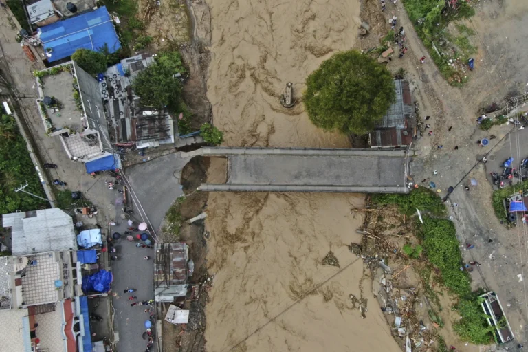 Flooding and landslides in Nepal kill at least 66 people, with as many again still missing