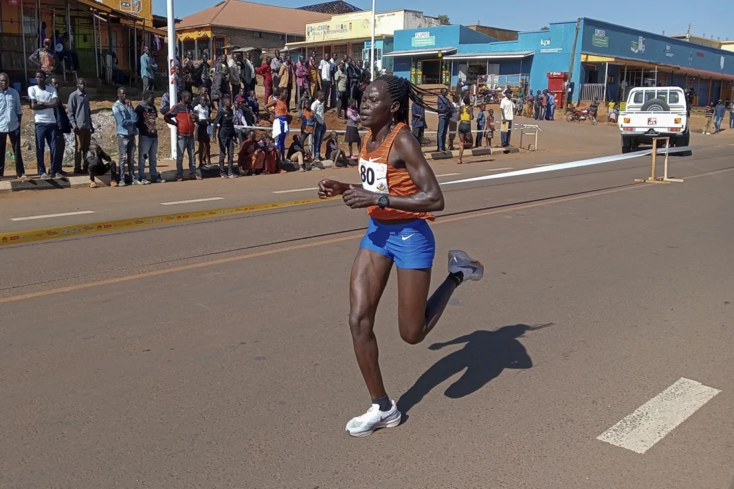 FILE- Rebecca Cheptegei competes: at the Discovery 10kmroad race int Kapchorwa, Uganda.