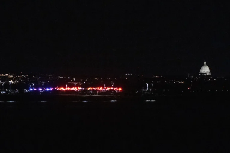 A passenger jet with 64 people on board collides with an Army helicopter while landing at Reagan Airport near Washington, D.C.